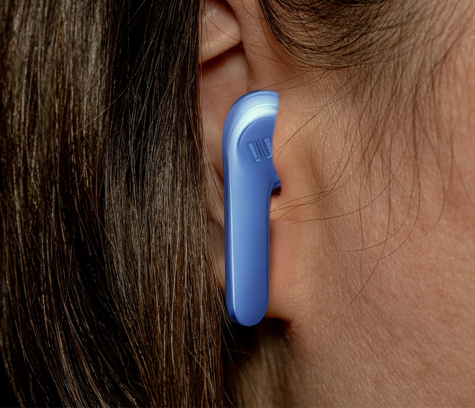 Close-up of JBL Vibe 200TWS earphones in a person's ear.
